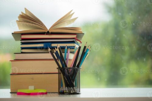 object-education-green-nature-background-with-stack-of-ancient-books-or-old-bible-open-paper-book-on-wooden-table-with-c